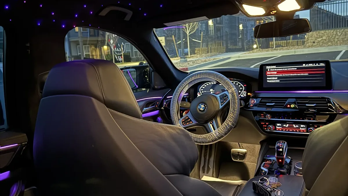 Freshly detailed car interior with clean seats, carpets and console