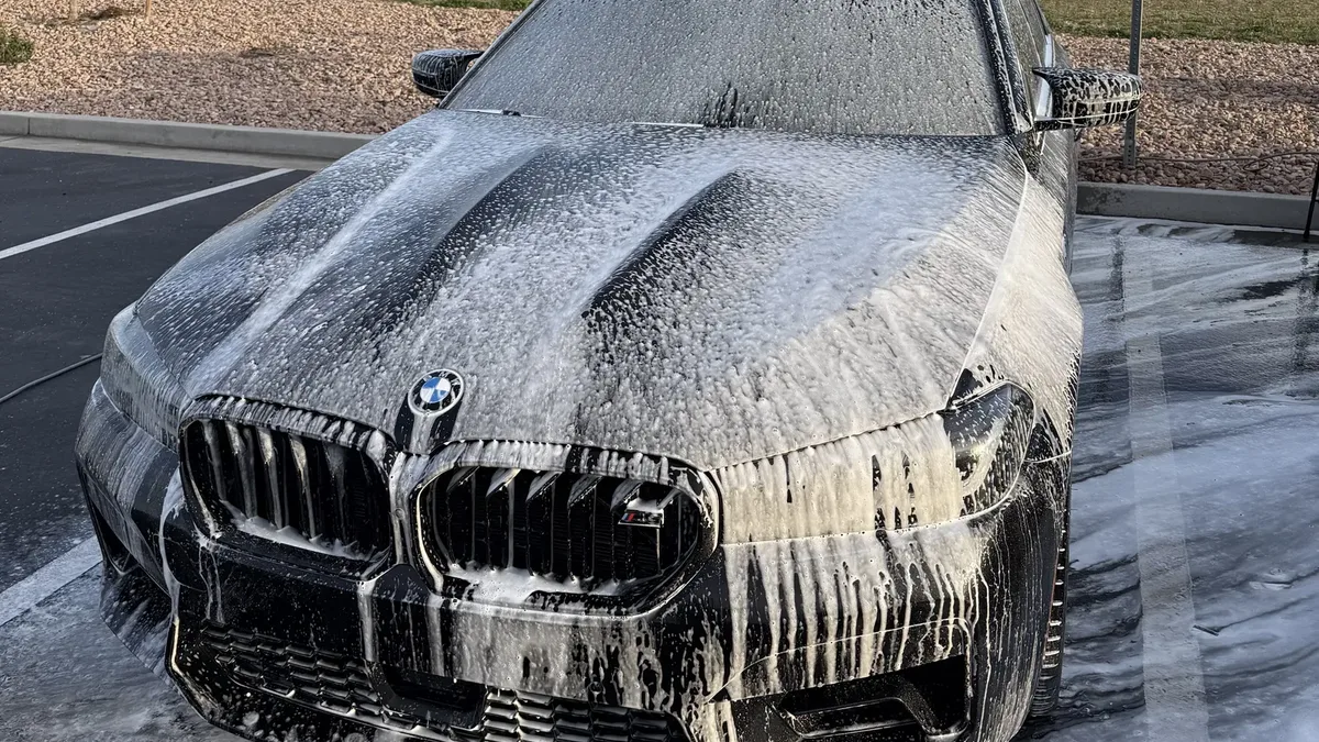 Freshly detailed car exterior with clean paint, wheels and glass